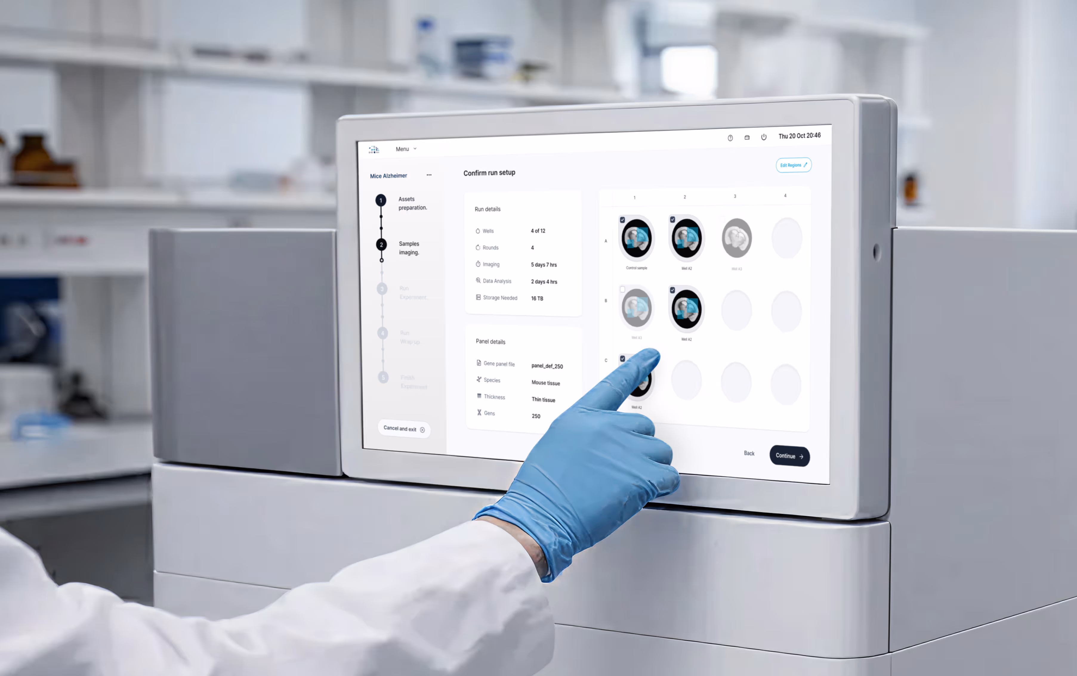Lab technician in gloves interacting with the Pyxa touchscreen interface, navigating the Confirm Run Setup screen with well status indicators.