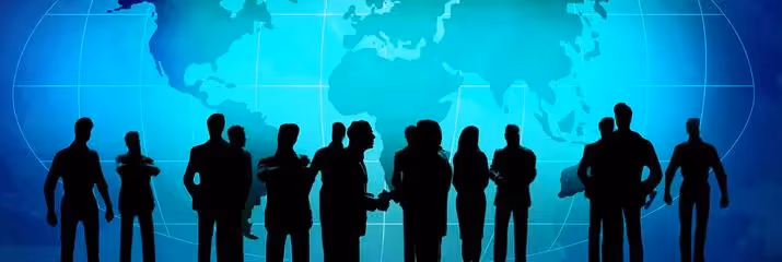 Crowd of people standing in front of world map
