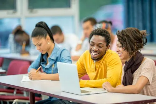 Students sitting in a classroom and smiling