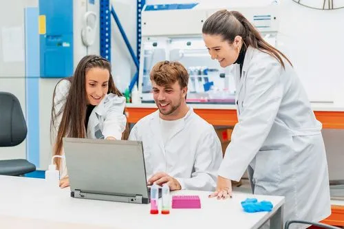Three science students in a lab