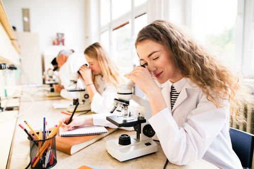 Science student with microscope