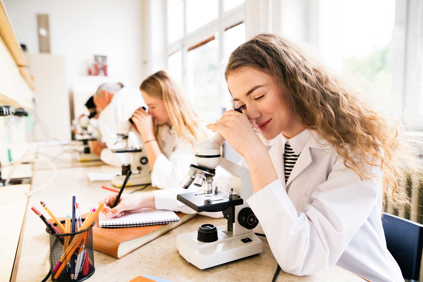 Science student with microscope