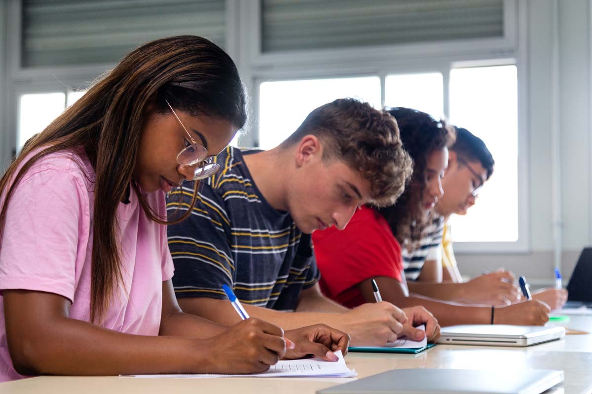 Students working at desk.