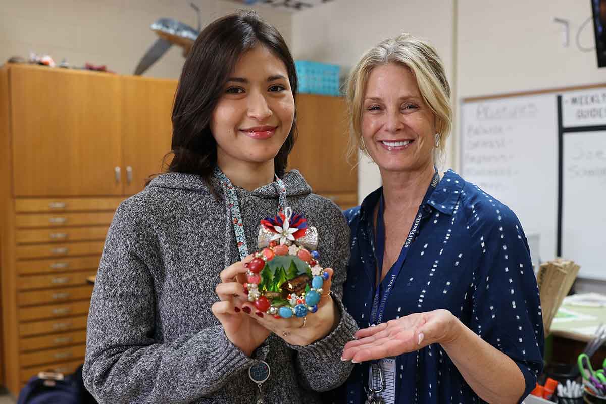 MHS student with art teacher