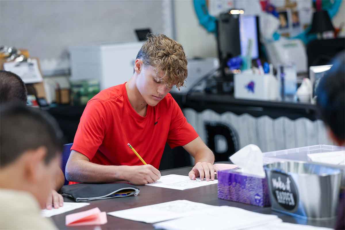 Student working at desk.