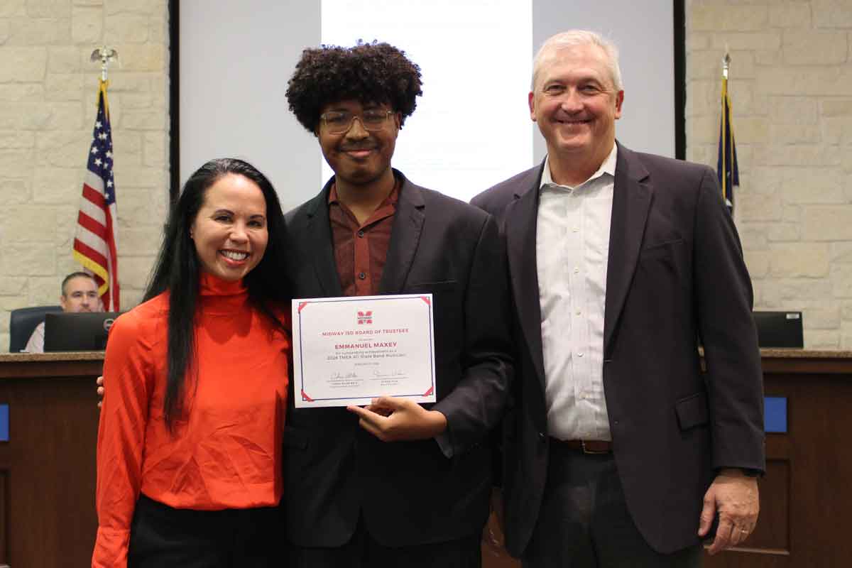 Band student with teacher and board member