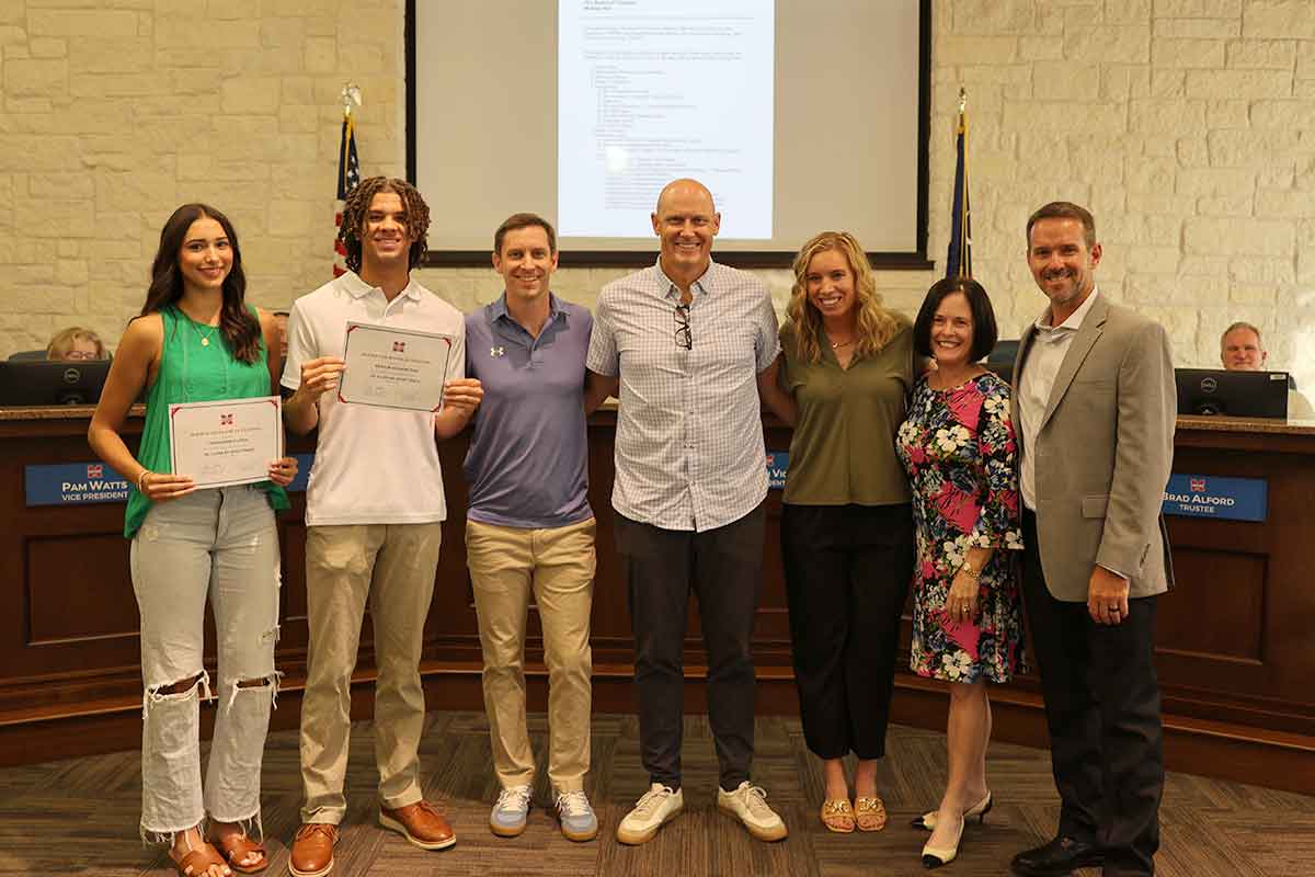 Midway High School student-athletes and coaches receiving award.