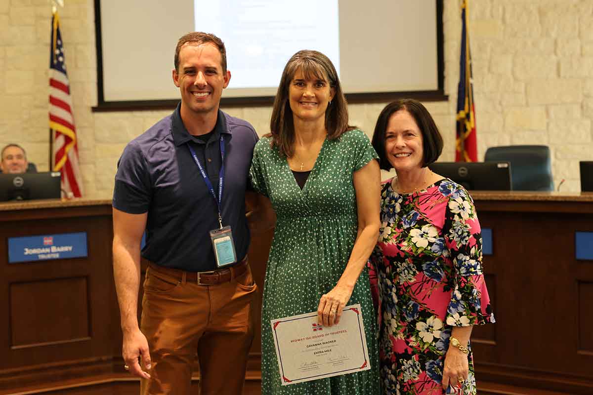 Castleman Creek Elementary teacher GayAnna Wagner receives an award.