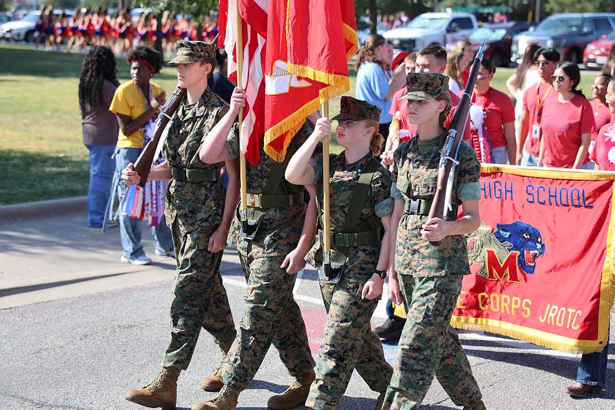 Midway High School’s Marine Corps Junior ROTC students marching.