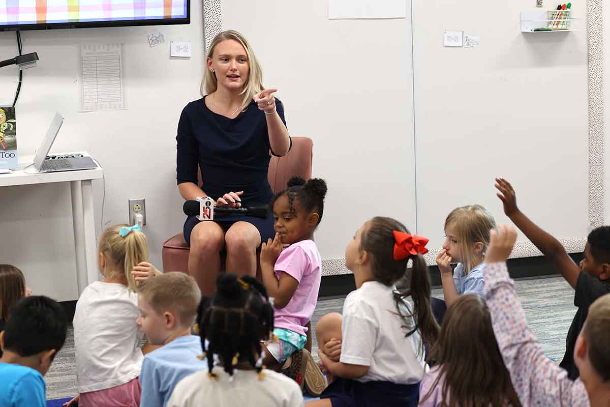 Channel 25 reporter Alexa Conroy talking with students.