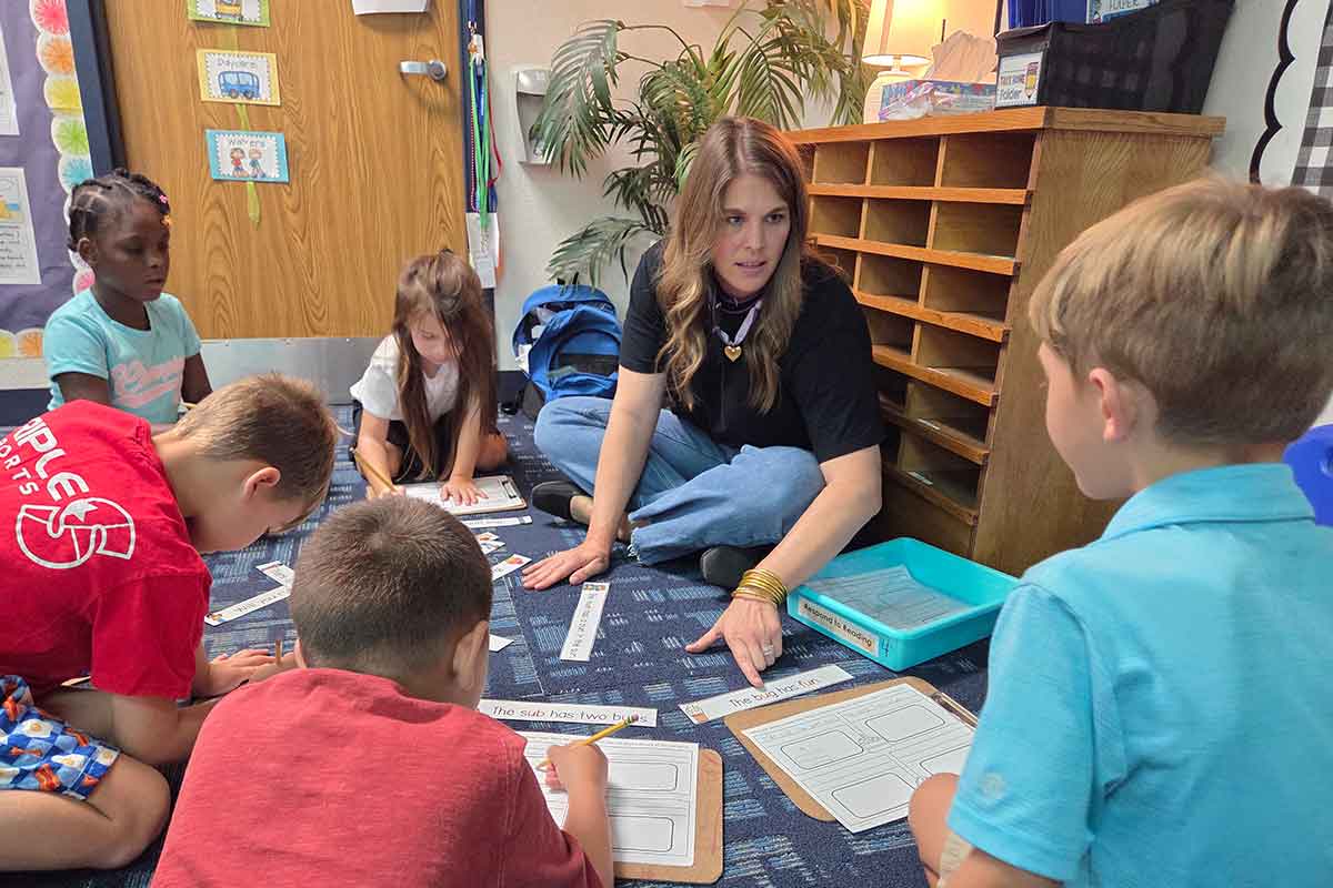 Midway teacher working with students.