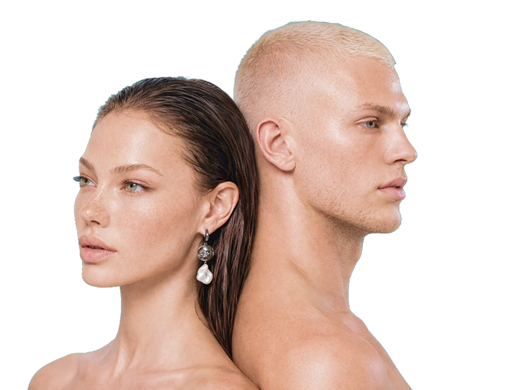 Close-up of a bare-shouldered woman and man standing back to back, both looking sideways.