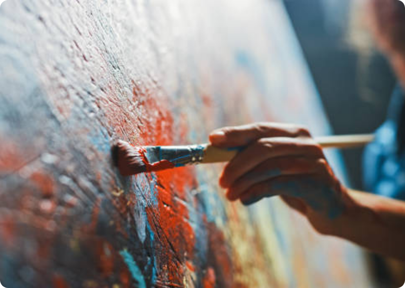 Person painting on a canvas