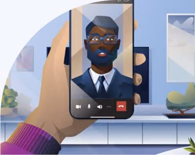 Hand holding a smartphone showing a video call with a man wearing glasses, a beard, and a suit in a modern room with a TV, plant, and artwork in the background.