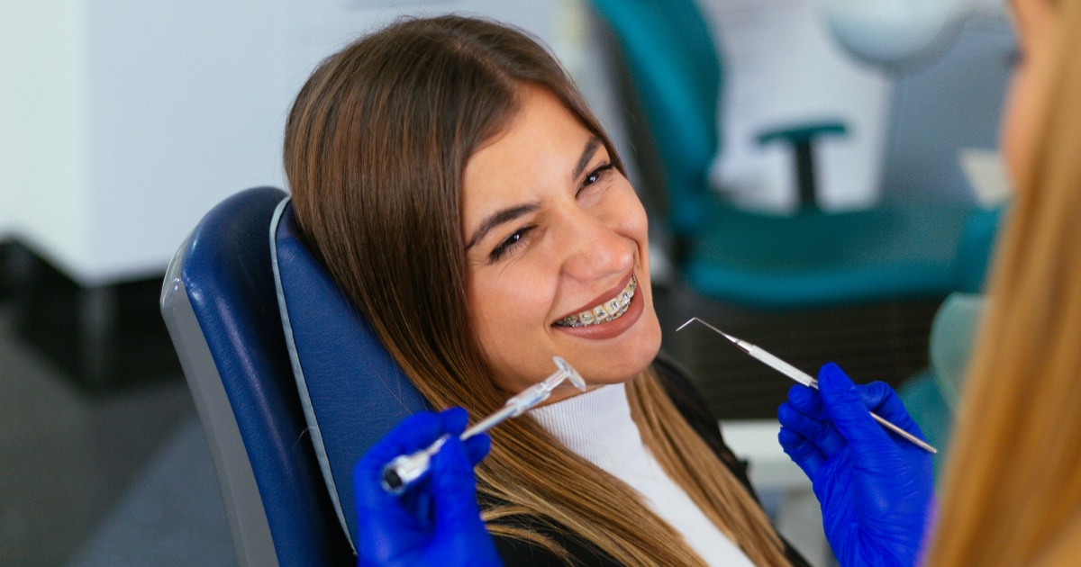 woman with braces in the dentist's chair