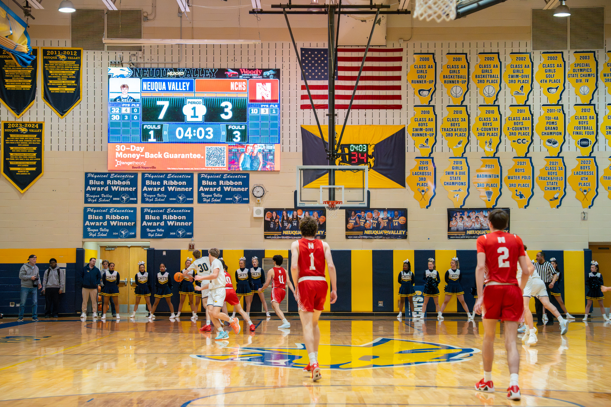 Neuqua Valley digital scoreboard advertisements shown during basketball game