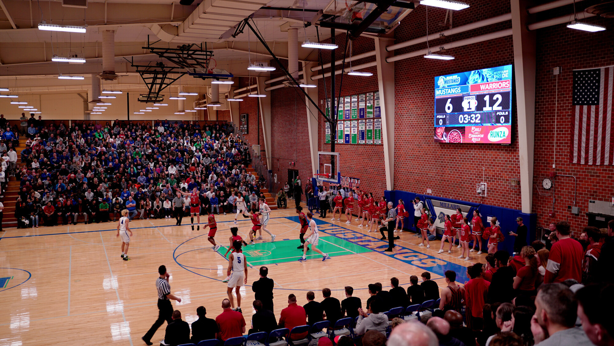 Millard North High School's upgraded gym with boosters and scoreboard sponsors