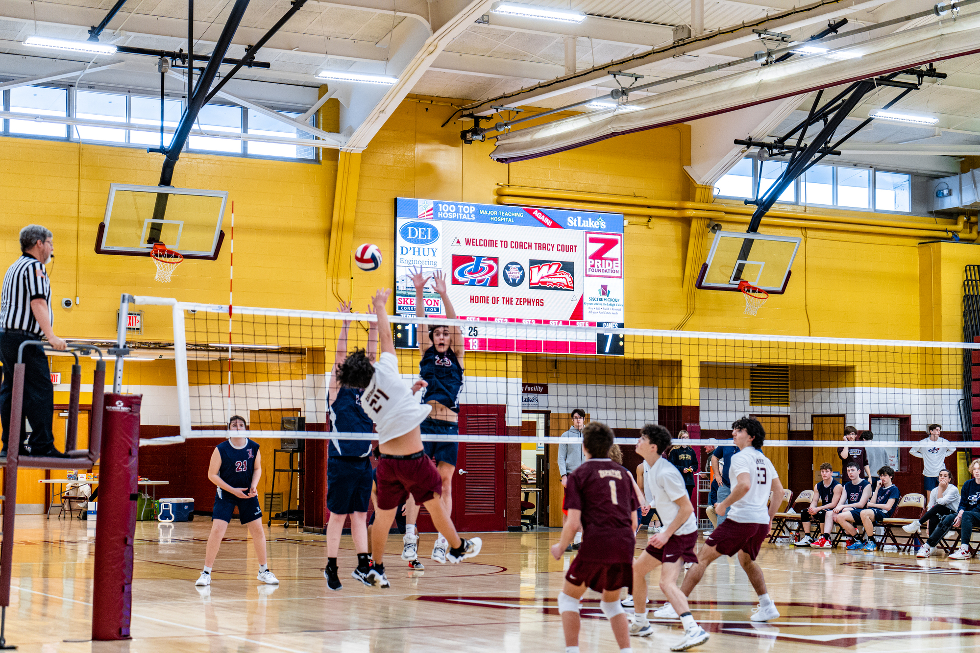 Volleyball scoreboard at Whitehall High School with scoreboard advertising from Scoreboard Media