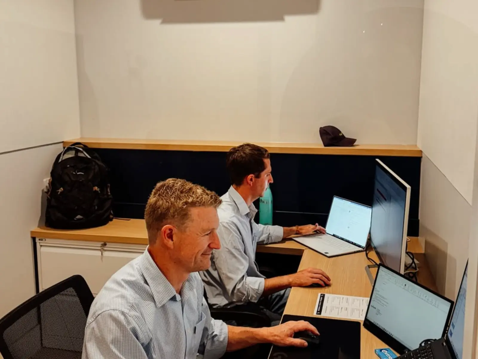 Two people working in a private office at Social Co House