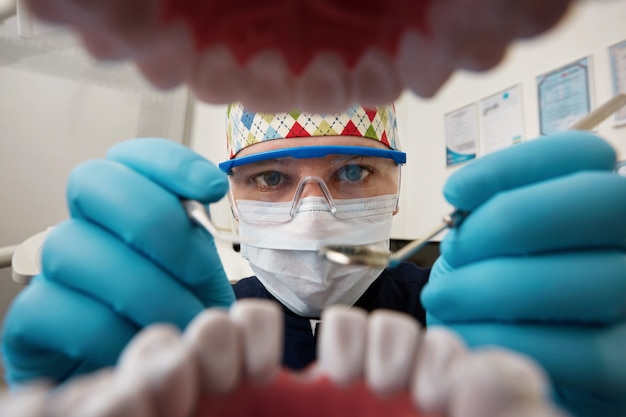 A Dentist Bridging the Dental Gap With a Tooth Bridge in a Patient's Mouth