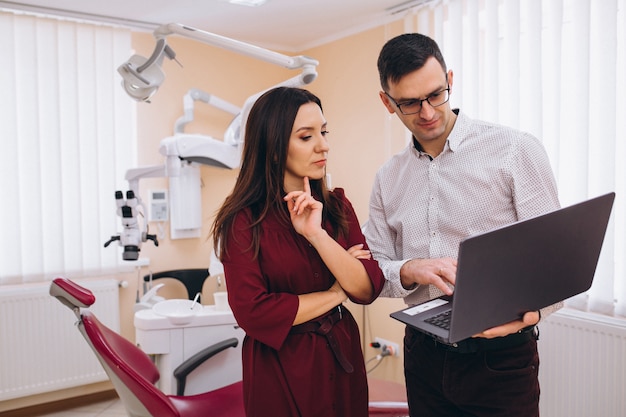 A Patient and Dentist Discussing Financing Options Dental Implant Pricing