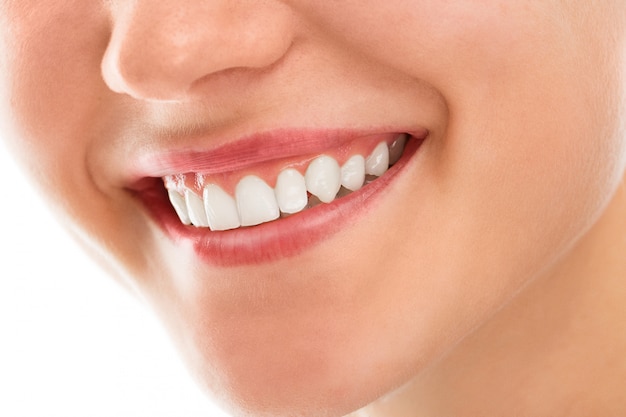 A Patient Smiling About Her Dental Implants Price Following Her Treatment