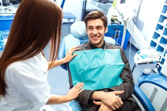 A friendly family dentist near me chats with a smiling patient at a trusted dentist office in Mercer Island, WA.