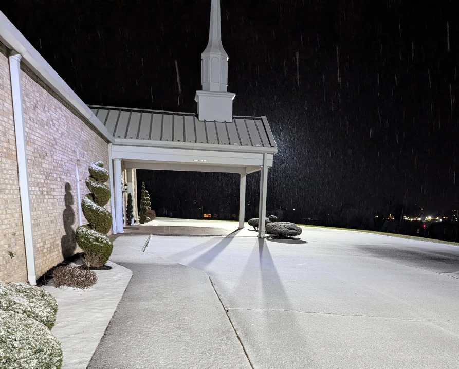 Photo taken on the morning of December 14th showing the snow covering the north side of the BHC Church parking lot