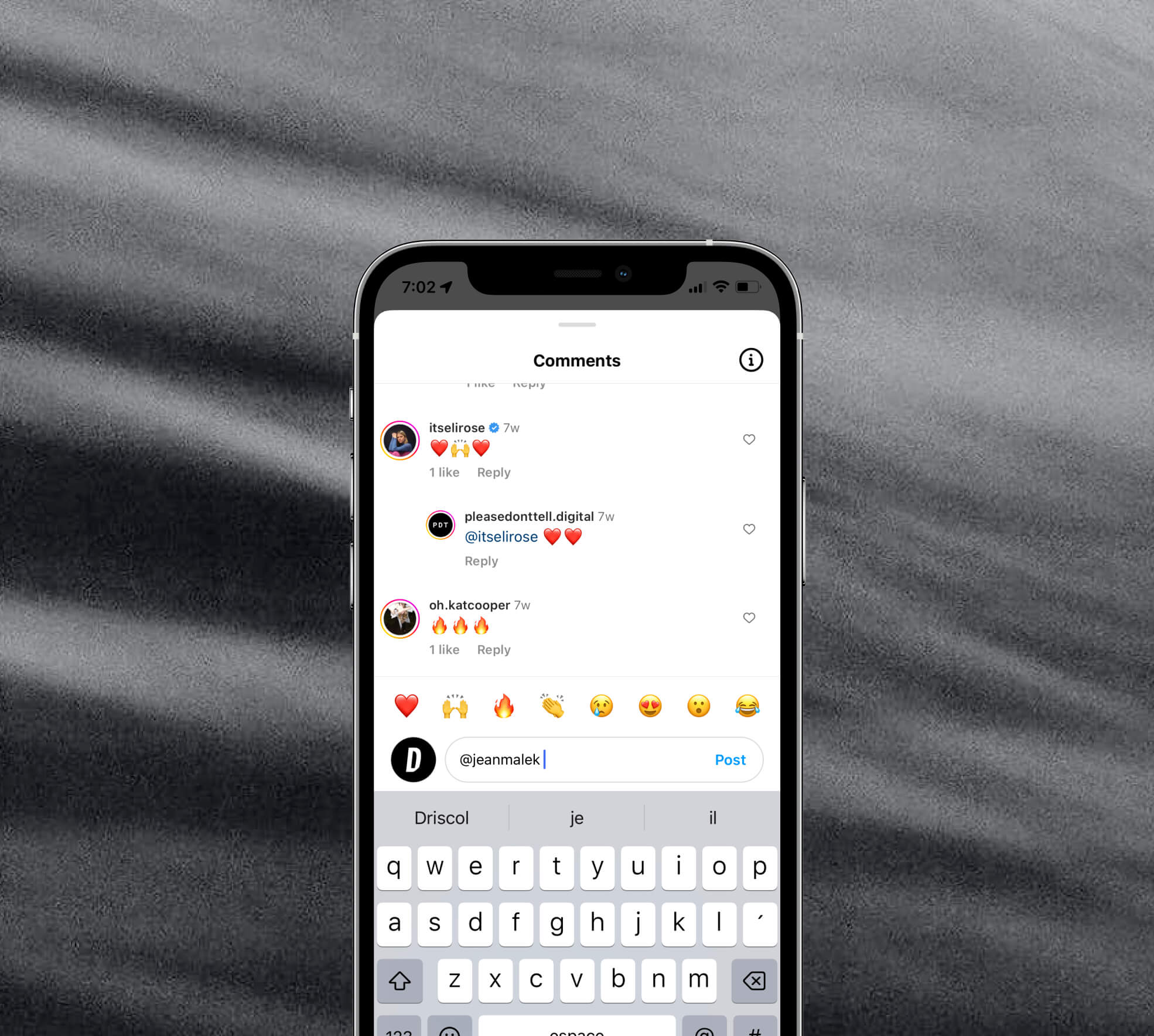 grey background with mobile phone screen overlay showing the comment section of a please don't tell instagram post