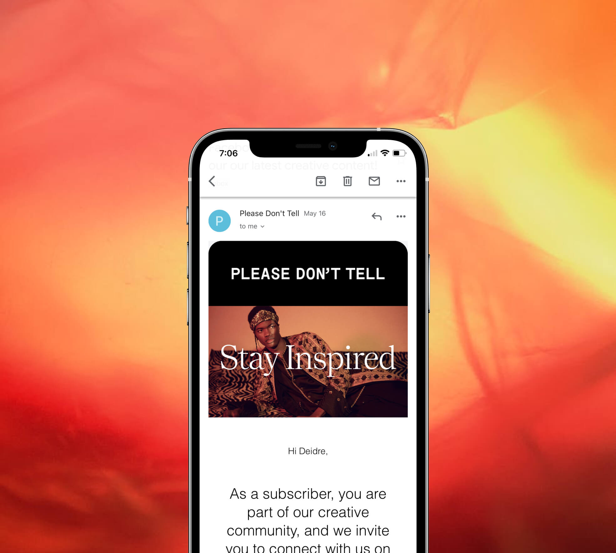 orange background with mobile phone overlay with a screen showing an email from please don't tell's newsletter