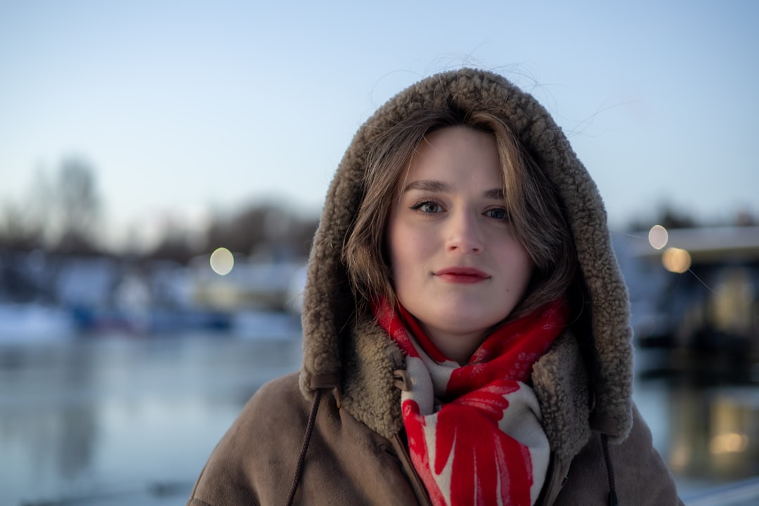 Young woman in winter coat and scarf outdoors