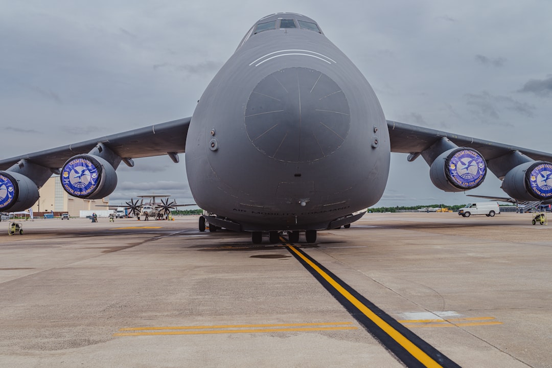 A large airplane sits on the runway.