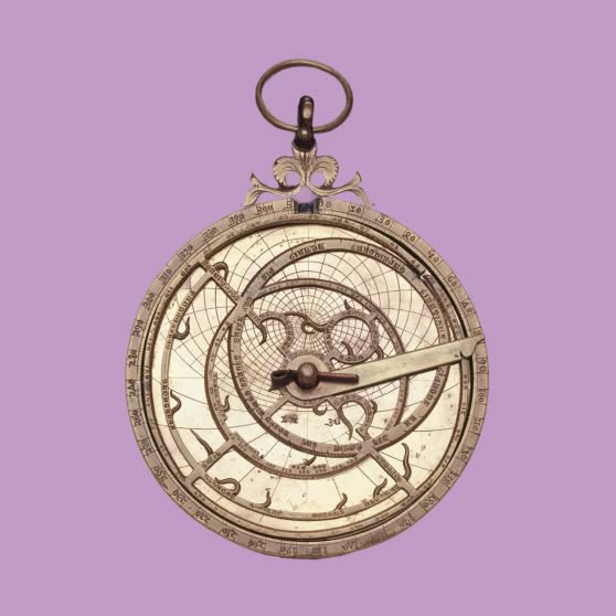 An antique brass astrolabe with concentric engraved rings, a rotating pointer, and a suspension loop, centered against a pale lavender background.