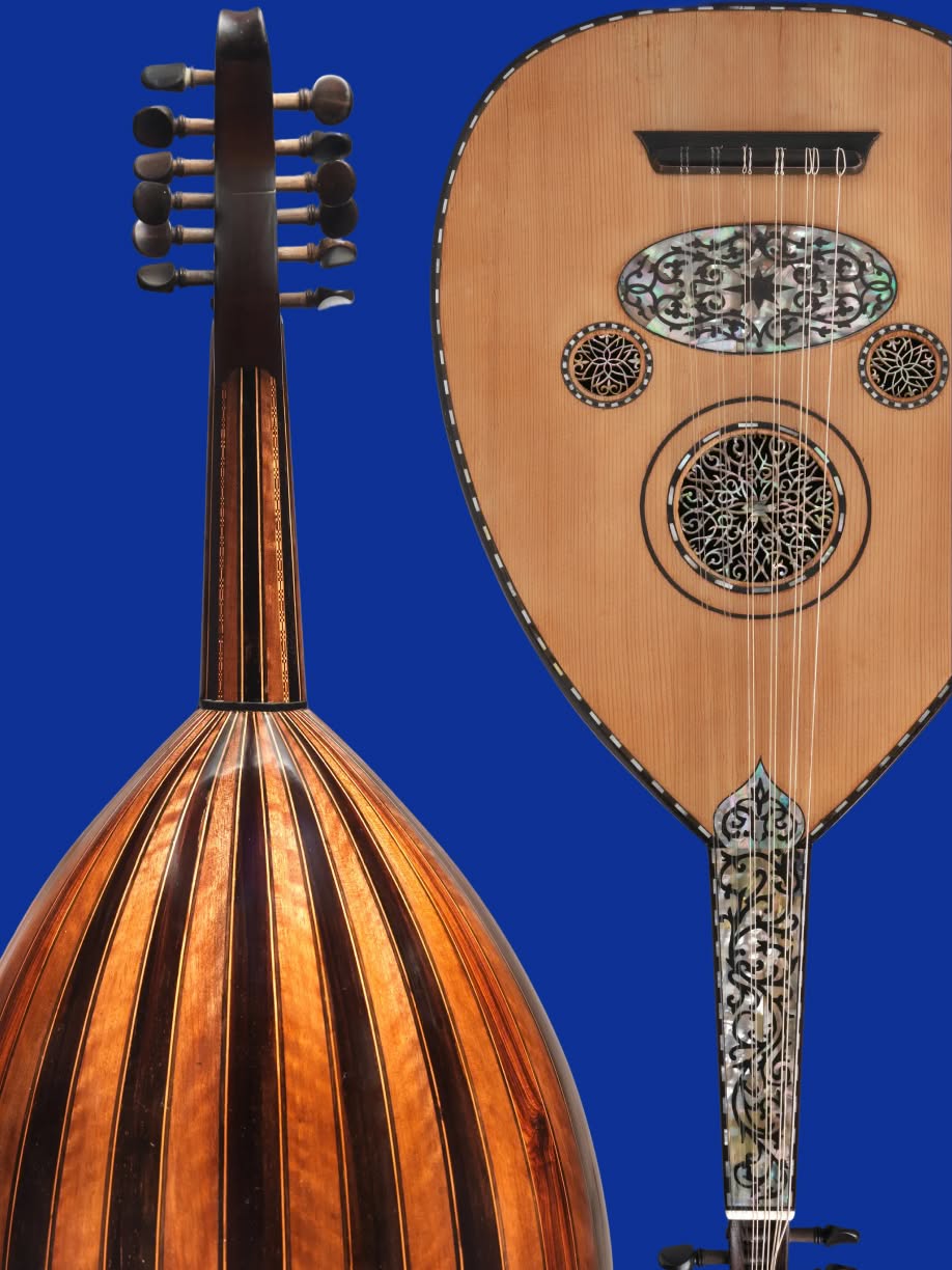 Front and back views of a wooden oud against a deep blue background, showing its pear-shaped ribbed body, short neck, and multiple tuning pegs. The soundboard features strings and ornate circular and oval inlays.