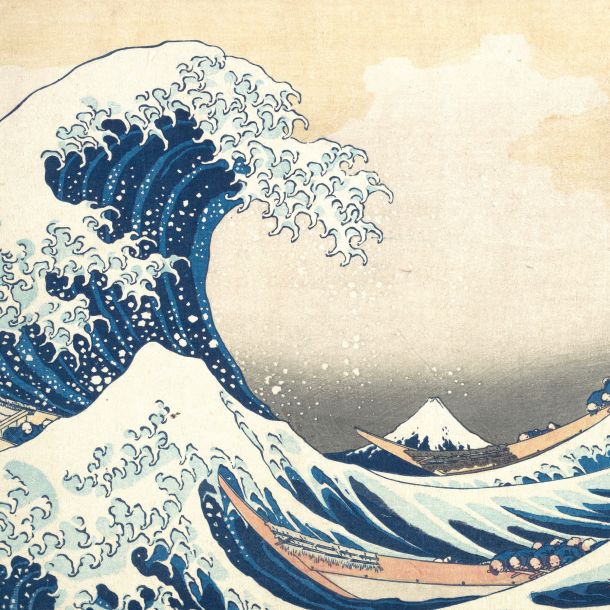 A woodblock print by Katsushika Hokusai made around 1831 depicting a towering blue wave curling over boats, with Mount Fuji in the distance.