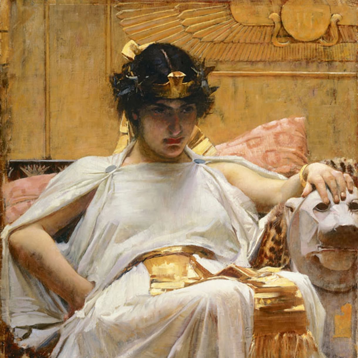 A painting depicts Cleopatra in white and gold Egyptian-style dress and headdress, resting one hand on a sculpted animal form against a richly decorated interior.