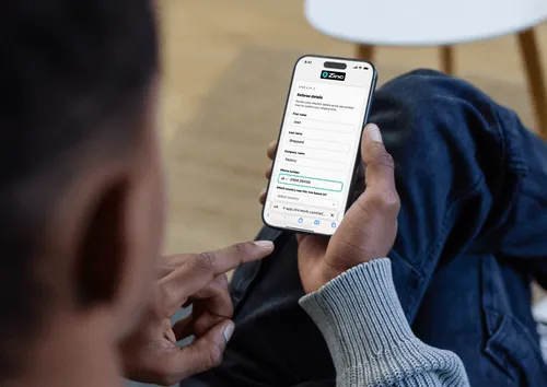 Person completing a Zinc referee details form on mobile