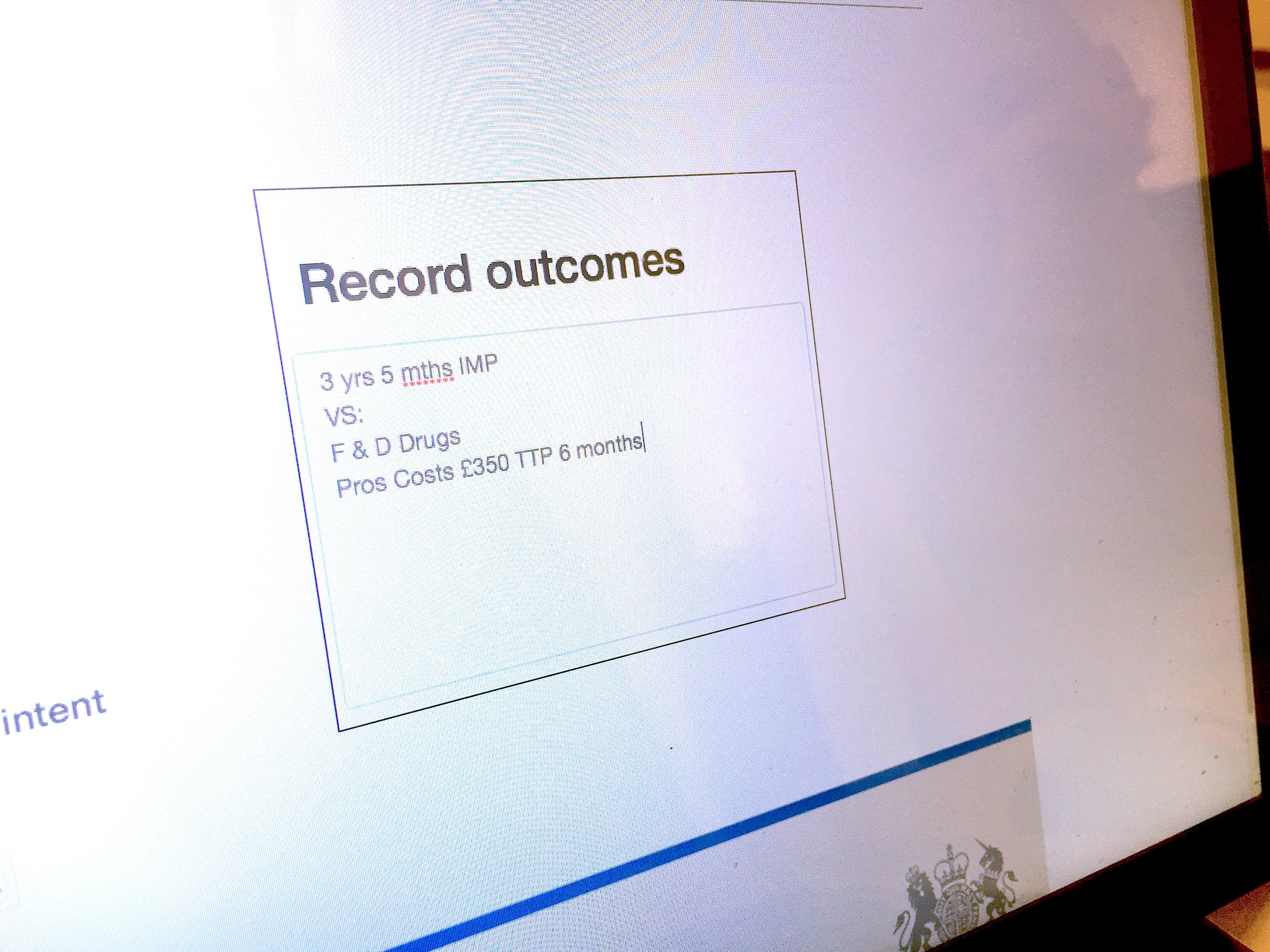 Computer screen showing a text box titled 'Record outcomes' with notes inside: '3 yrs 5 mths IMP VS: F & D Drugs Pros Costs £350 TTP 6 months'.