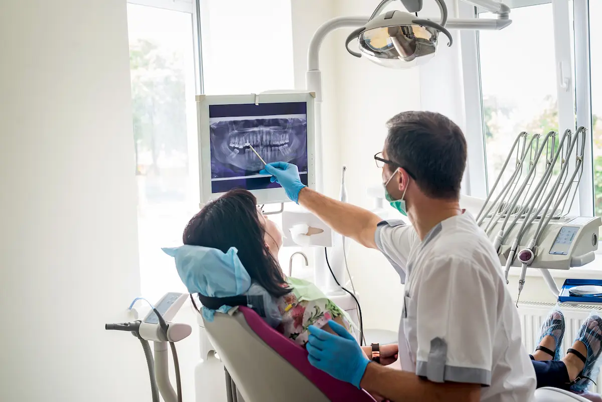 holding mouth in pain | Dental Implant Pain | Encinitas CA
