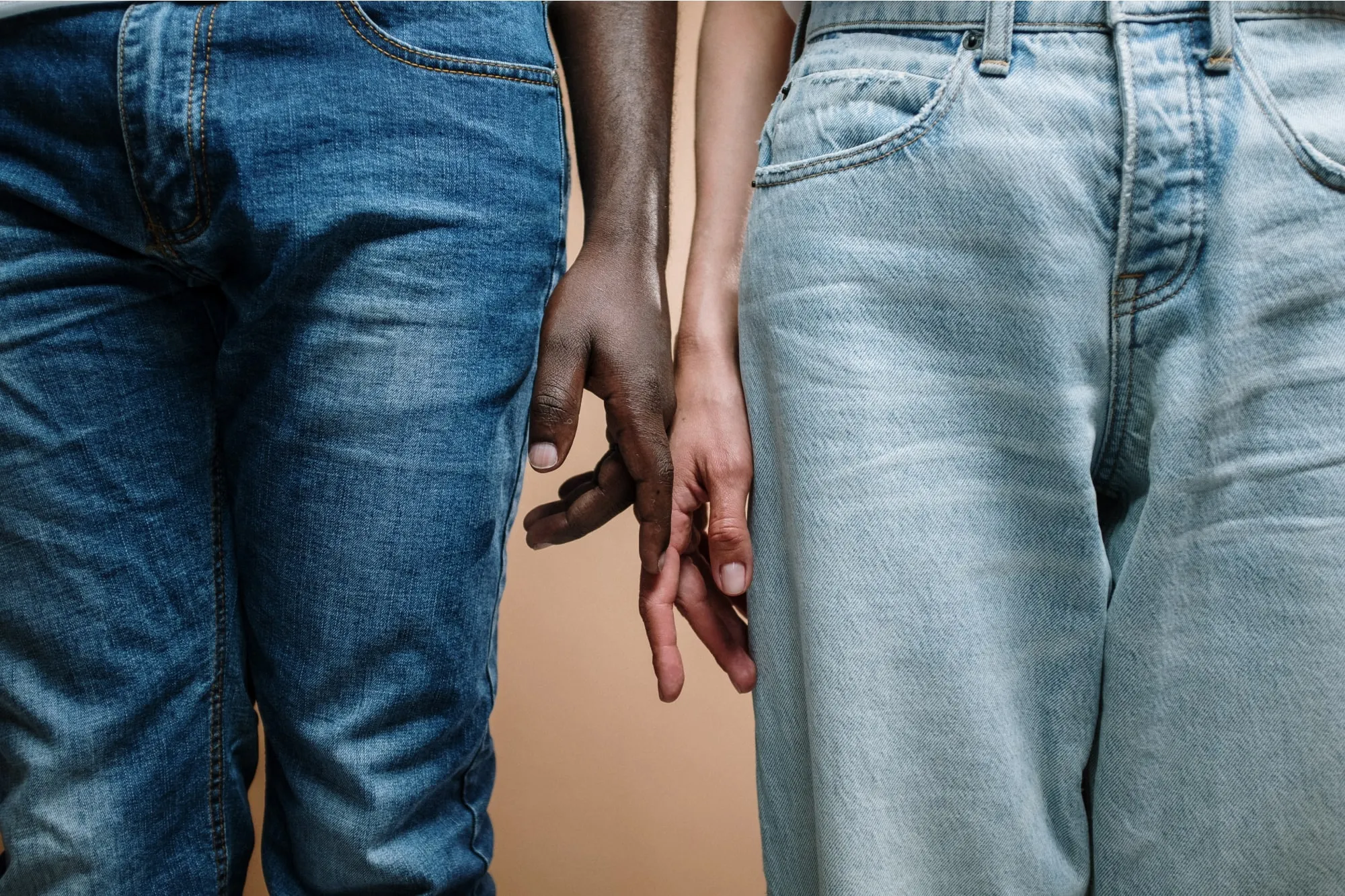 Two people touching hands