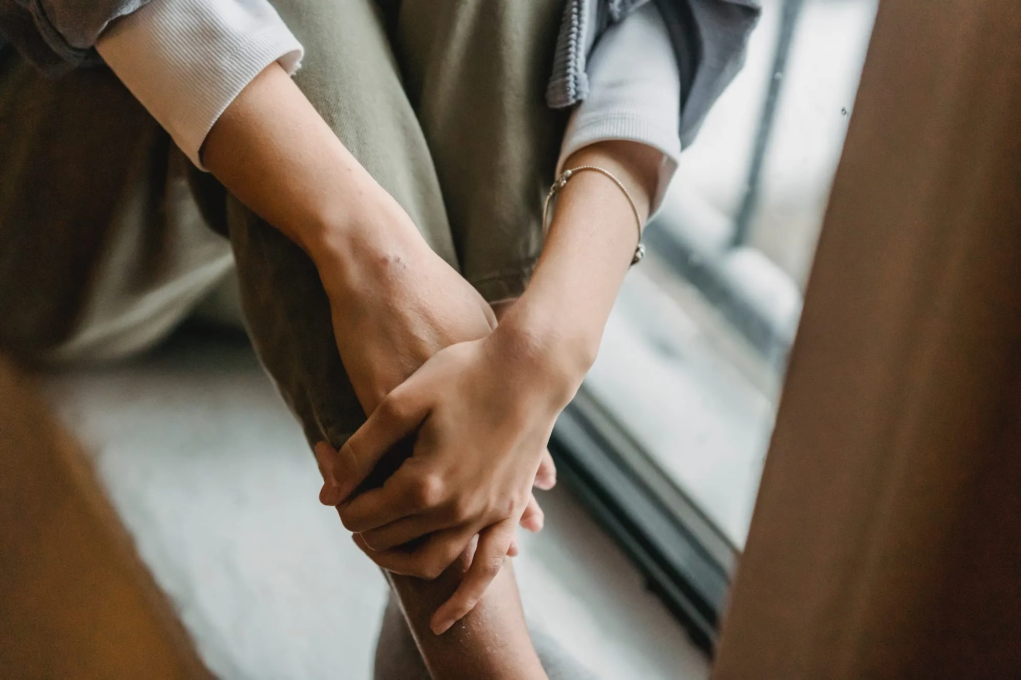 woman sitting by window