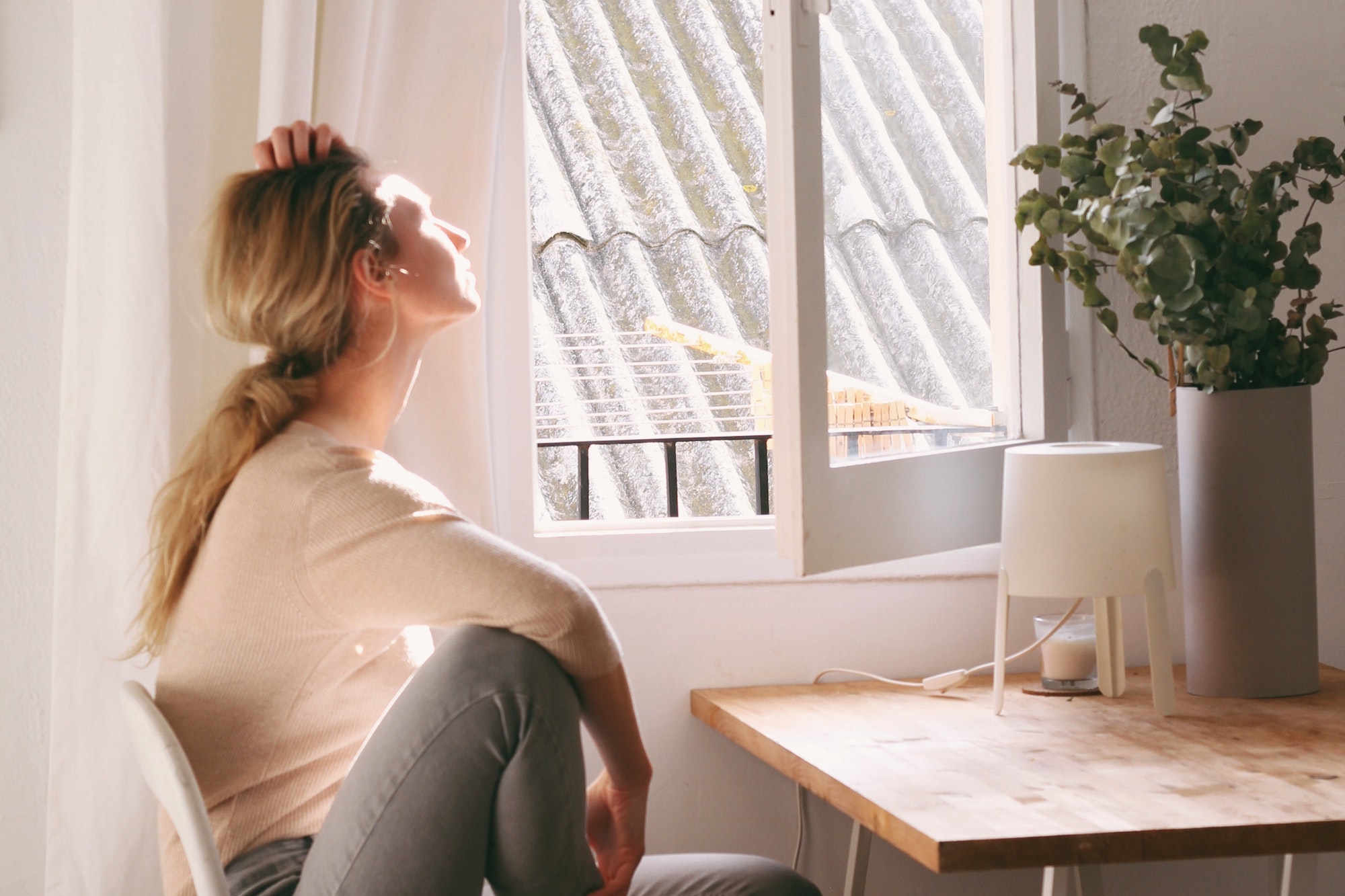 woman looking out window