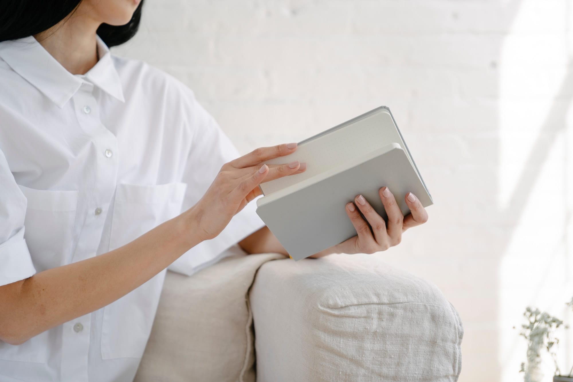 woman opening her journal
