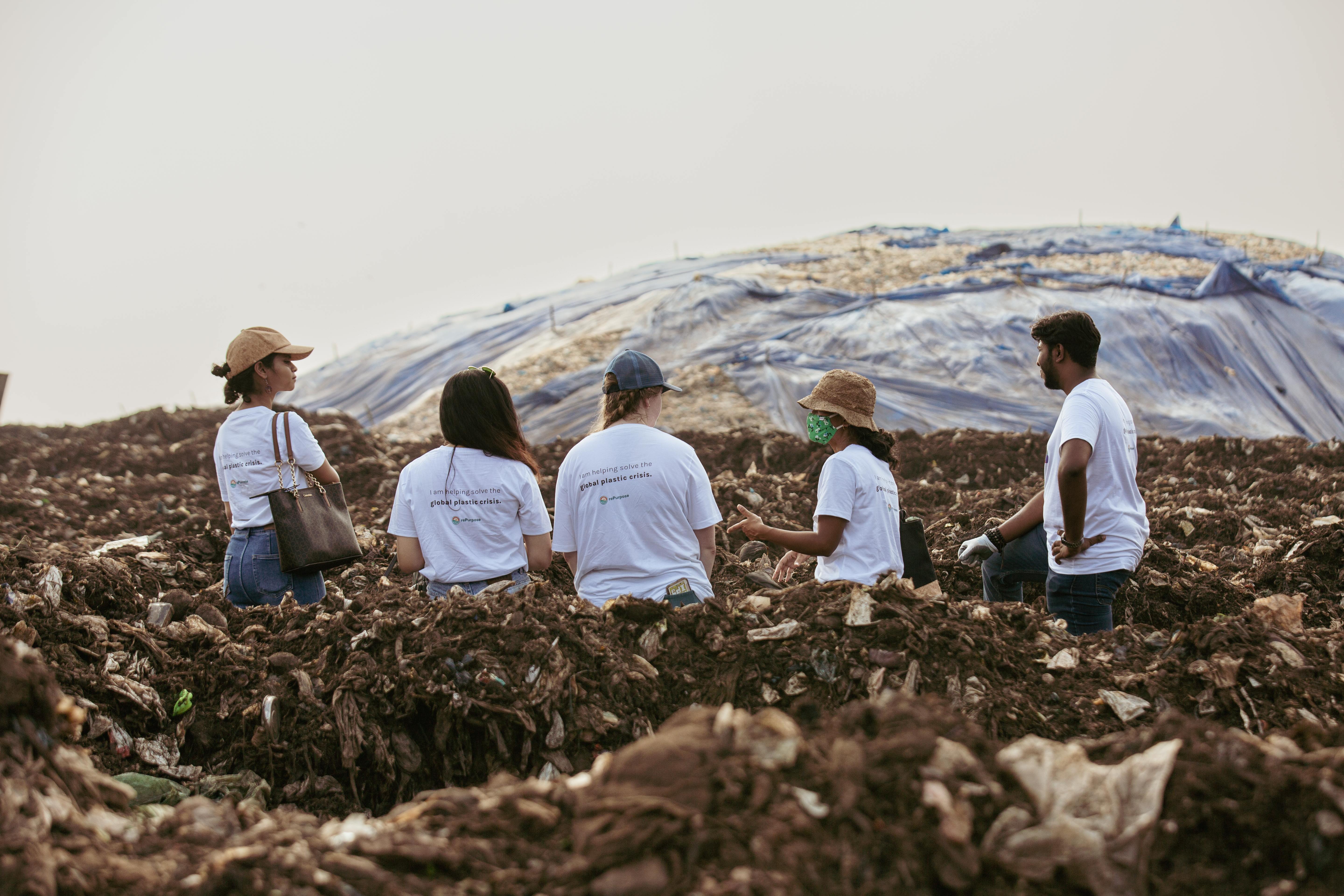 a group of people in a pile of dirt