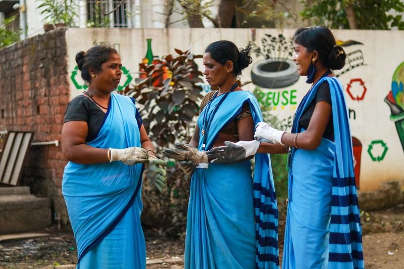 a group of women wearing blue dresses
