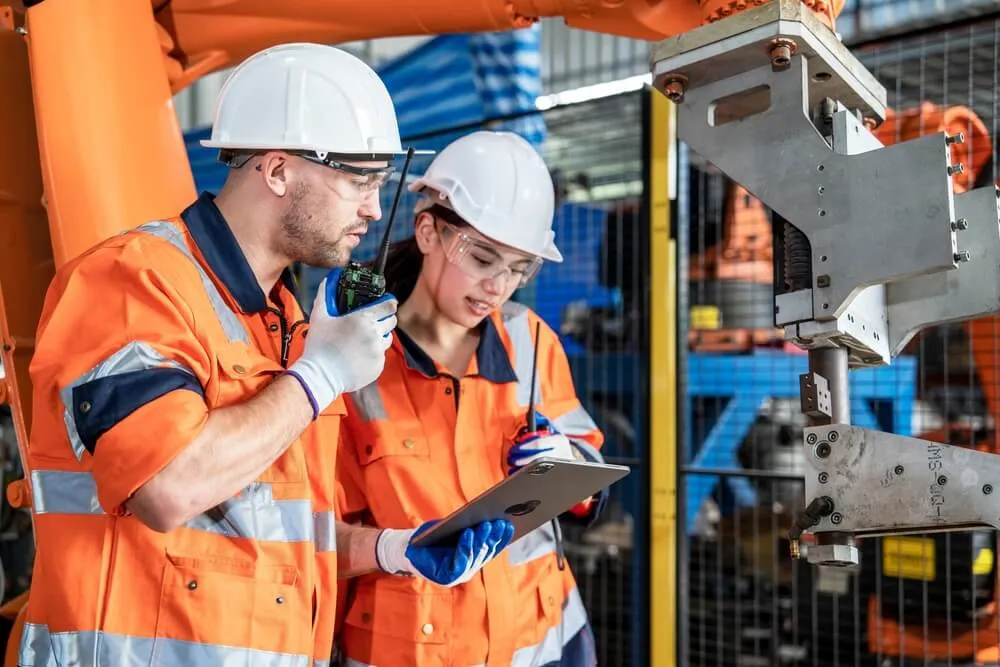 Male and female maintenance engineers working together
