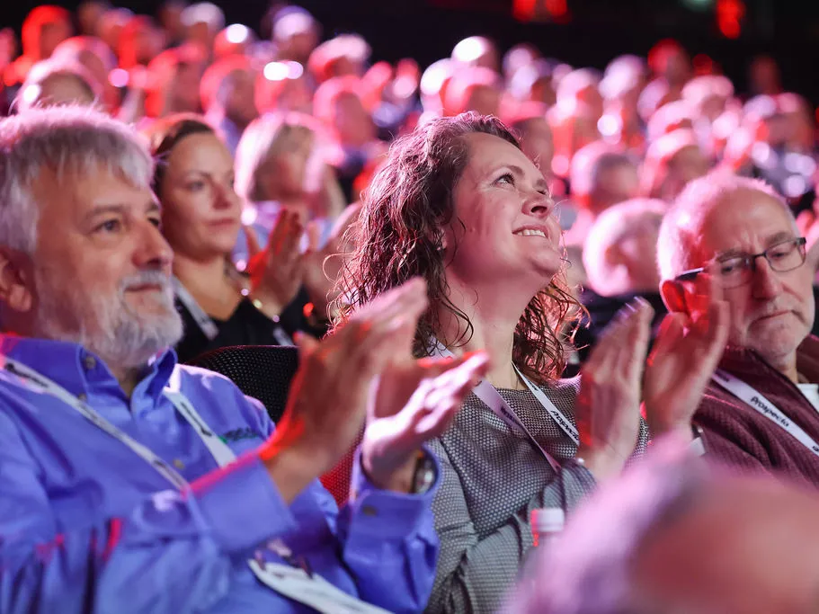 Audience clapping and smiling during Mainstream UK Summit