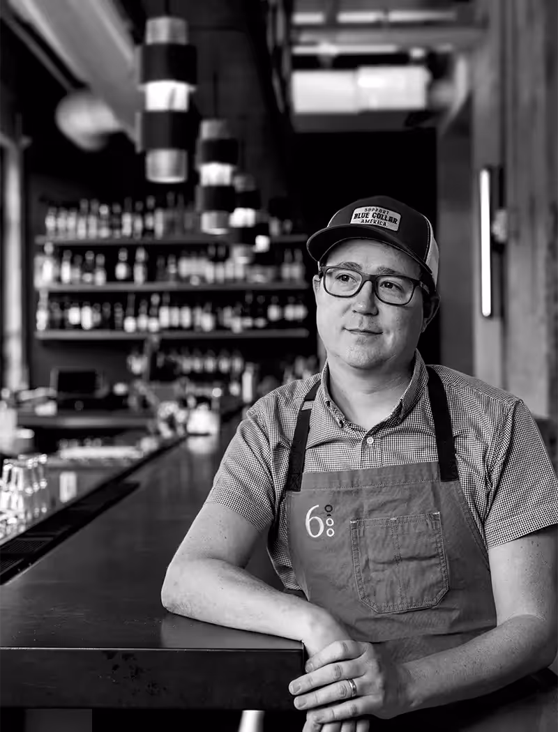 Executive chef wearing custom branded apron.