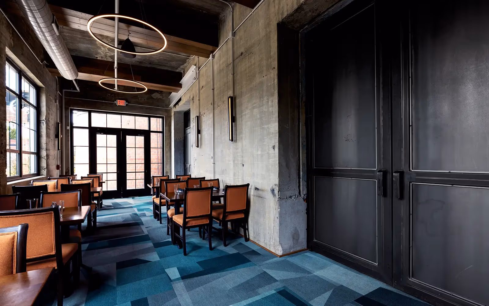 Interior view of an upscale restaurant in side an old industrial coal burning power plant.