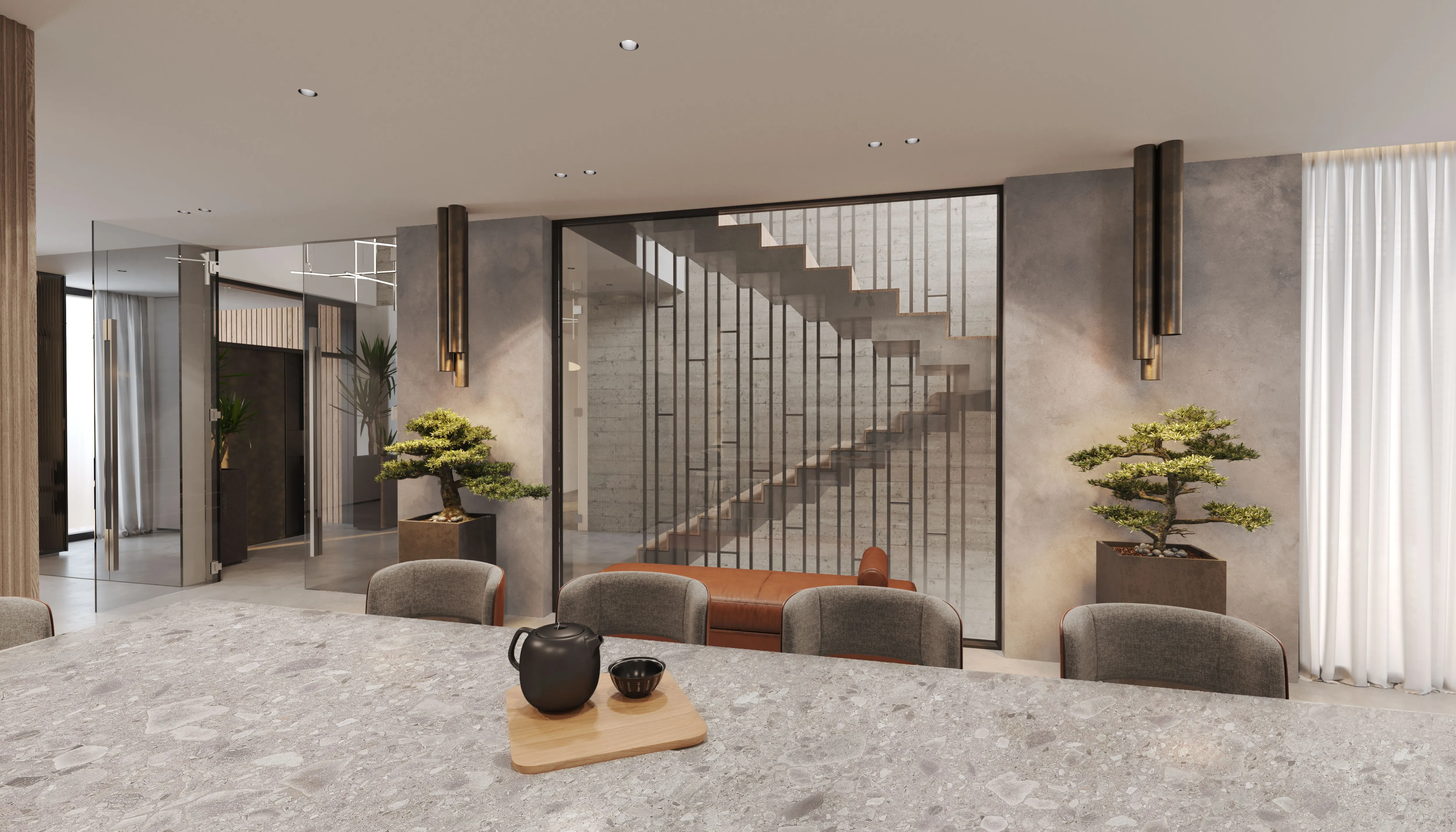 Sophisticated view from kitchen island looking toward a modern staircase enclosed with vertical iron slats and surrounded by bonsai plants, glass panels, and ambient lighting.